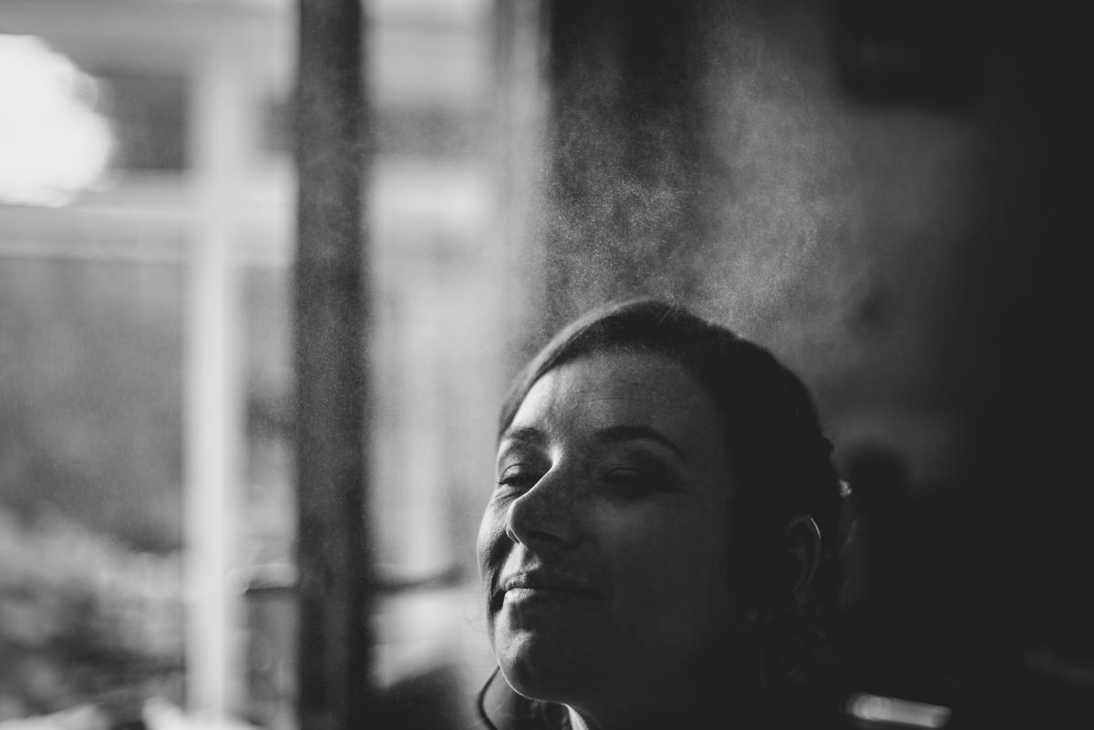 clock-barn-wedding-hampshire-getting ready-spray-shot
