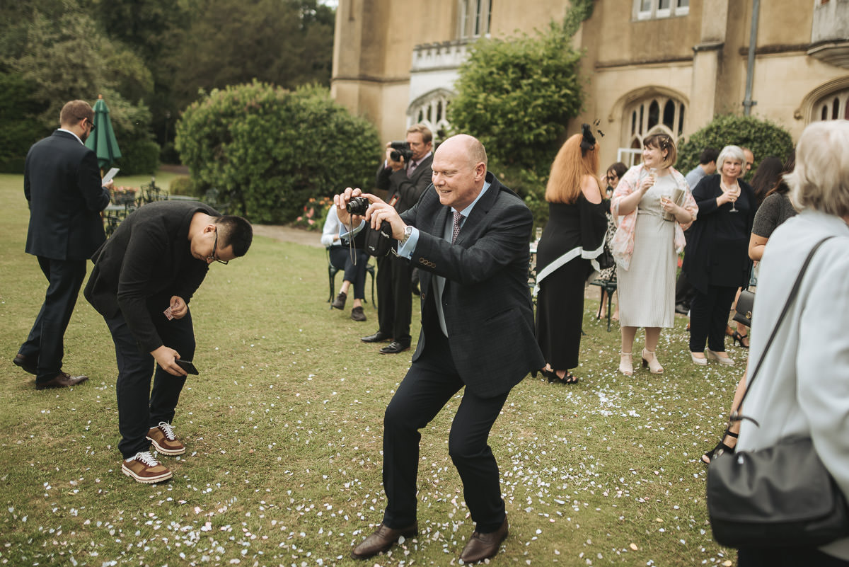 missenden abbey wedding guest with camera