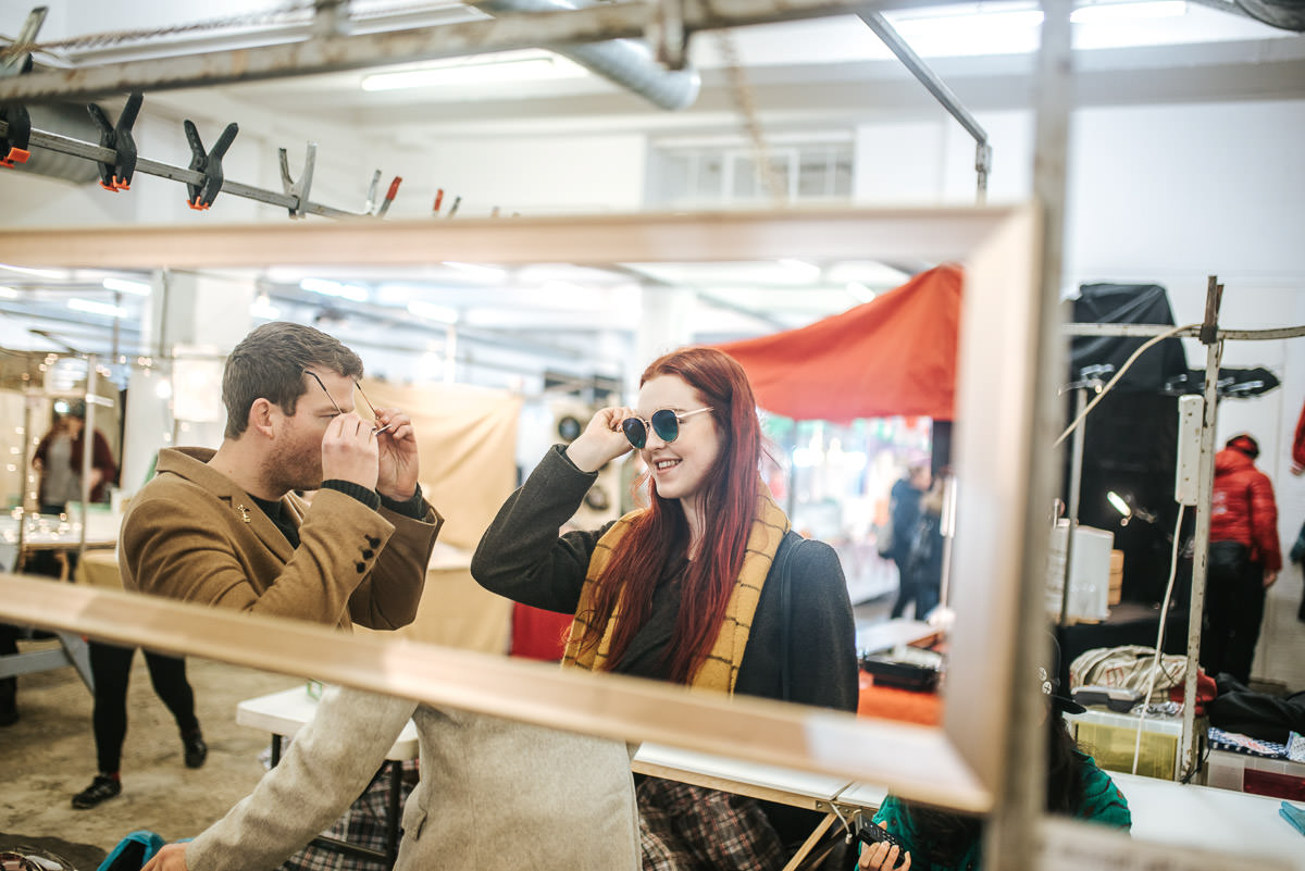 couple trying glsses on