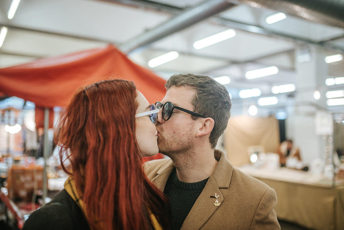 couple kissing in brick lane market