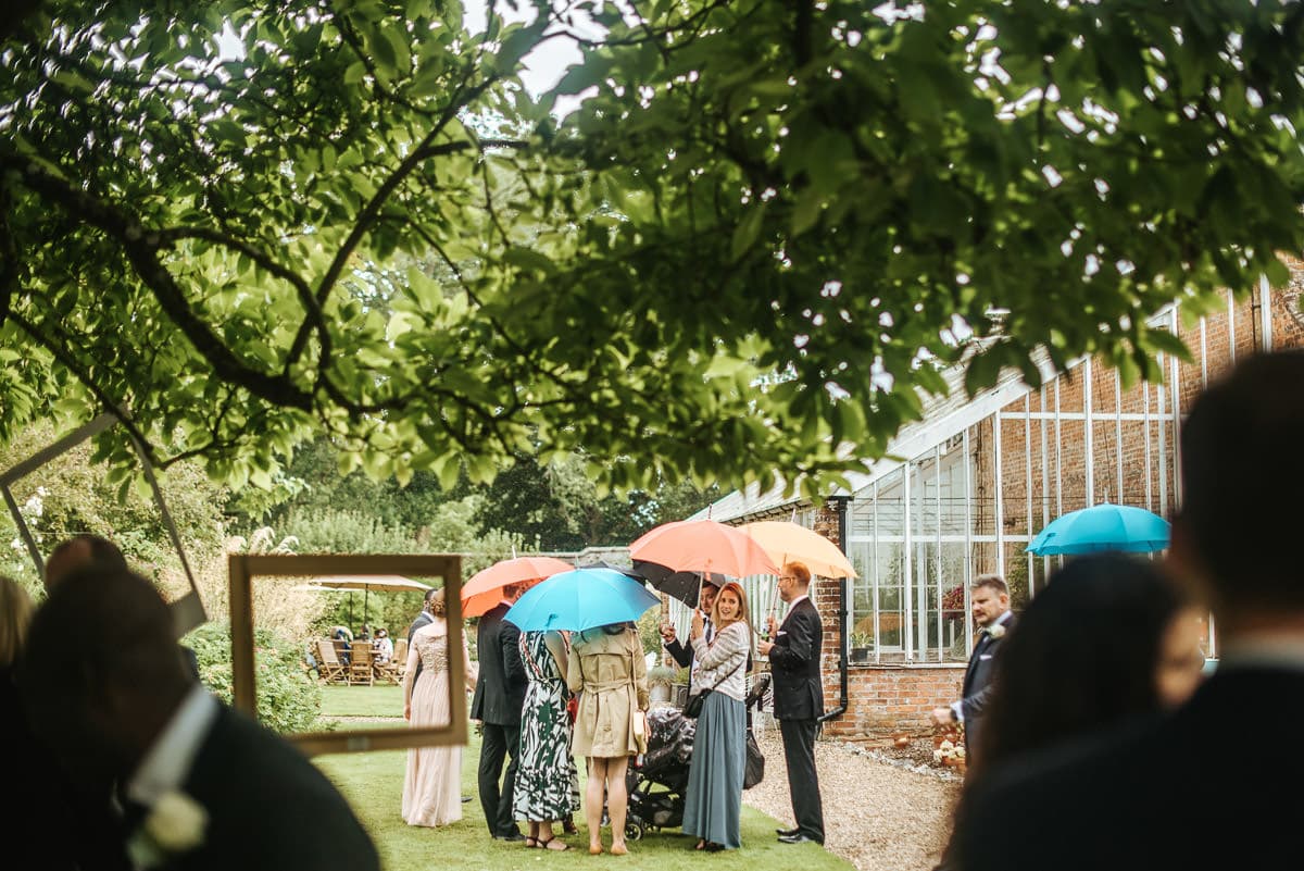 tipi wedding berkshire guests in the rain