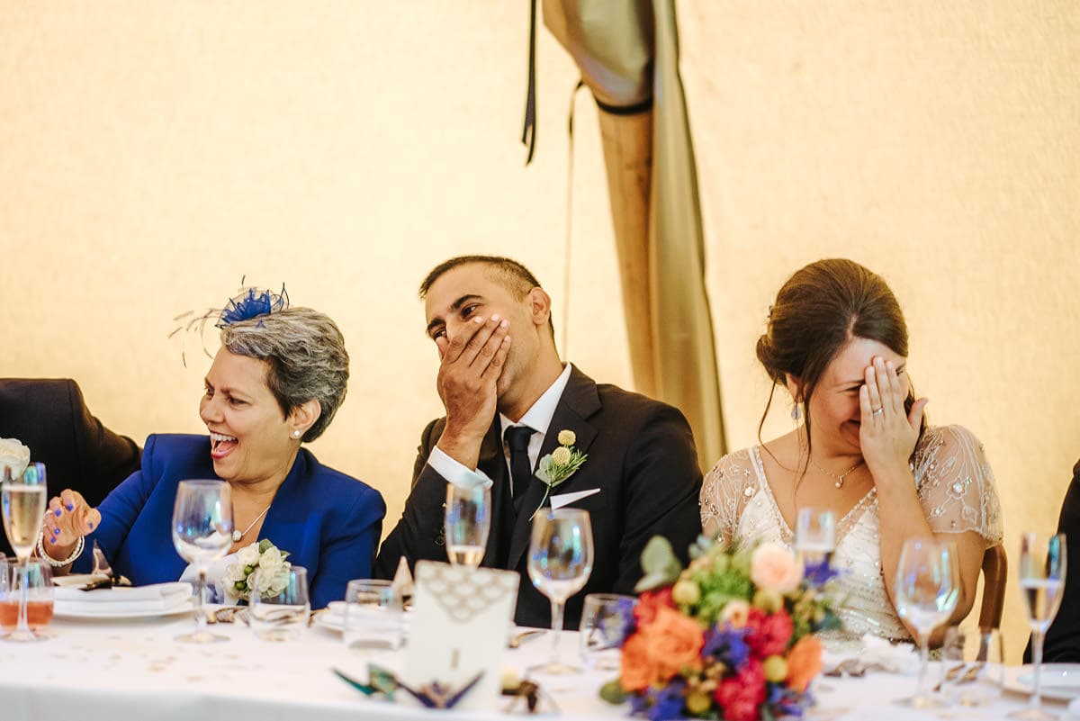tipi wedding berkshire bride and groom laughing