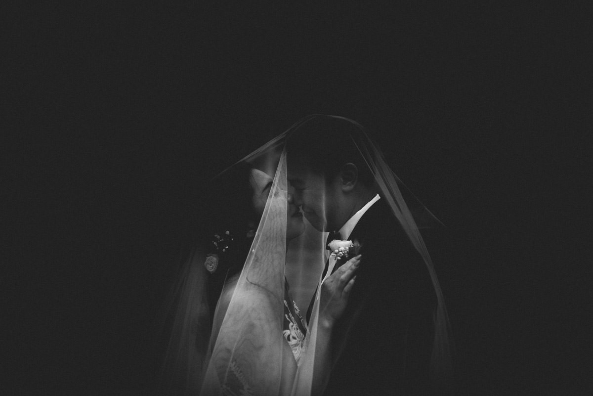 chinese wedding london hall place bexley bride and groom under the veil