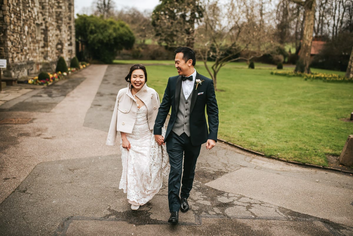 chinese wedding london hall place bexley bride and groom walking