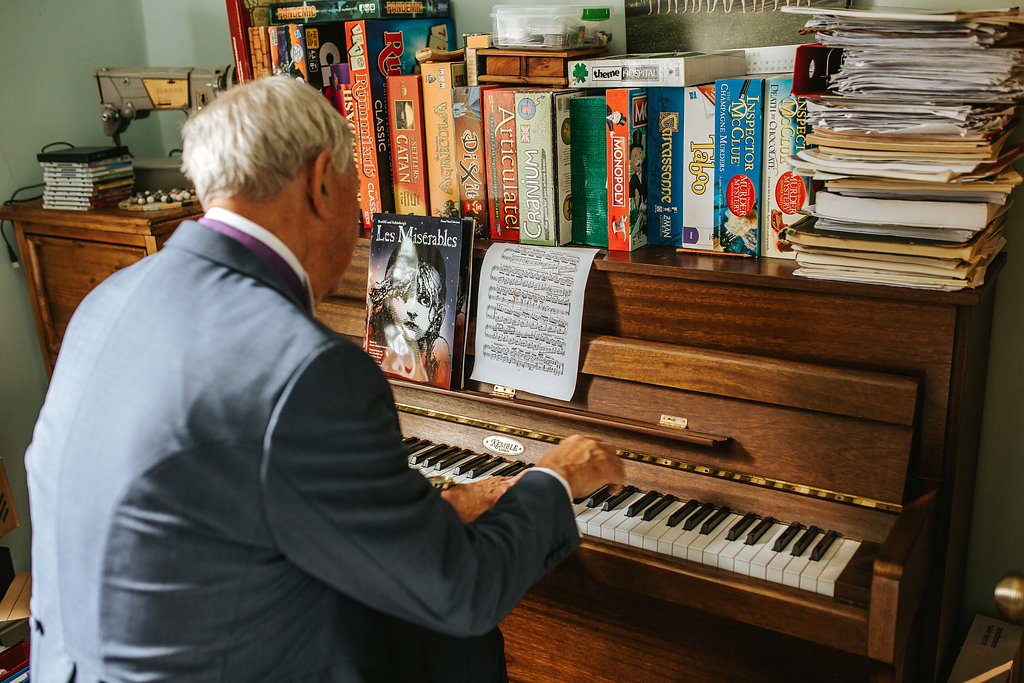 gay wedding photography dad playing piano