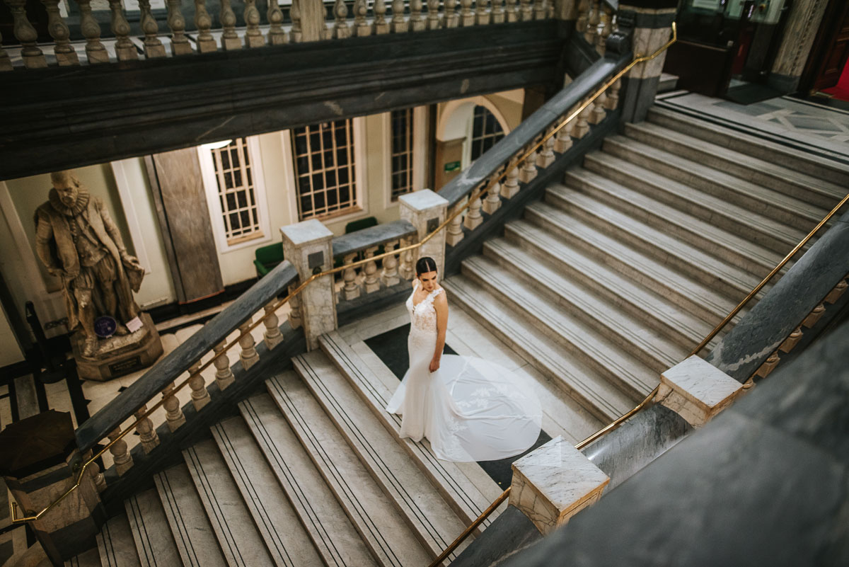 islington town hall wedding portrait of bride standing on the landing