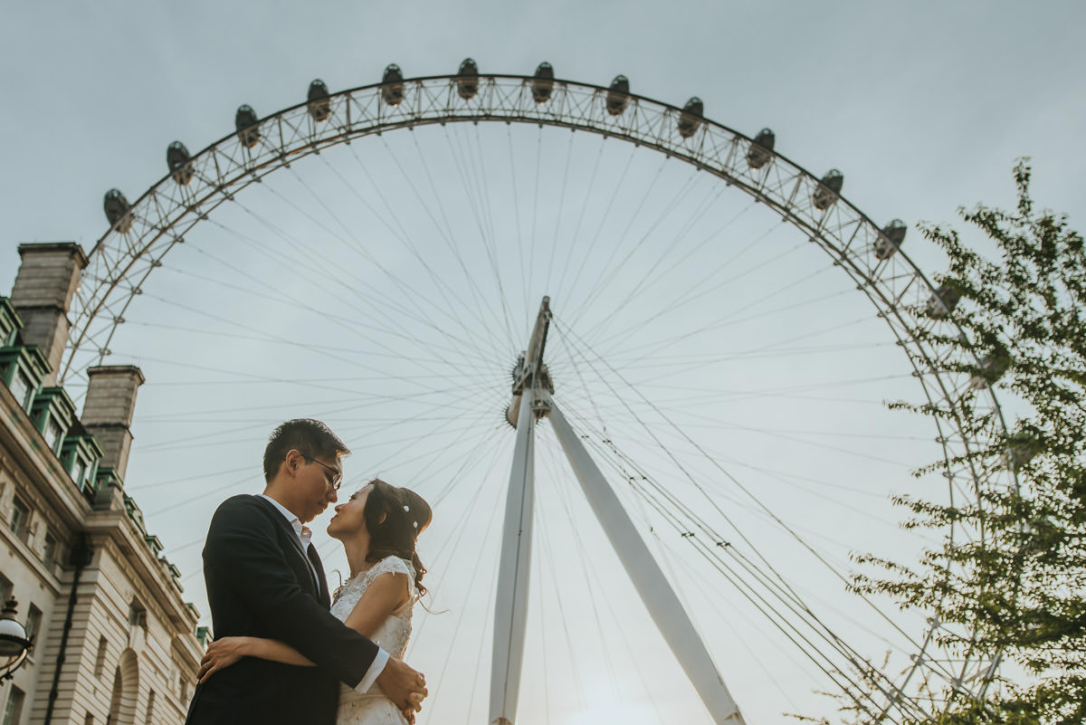 couple embracing by the london eye
