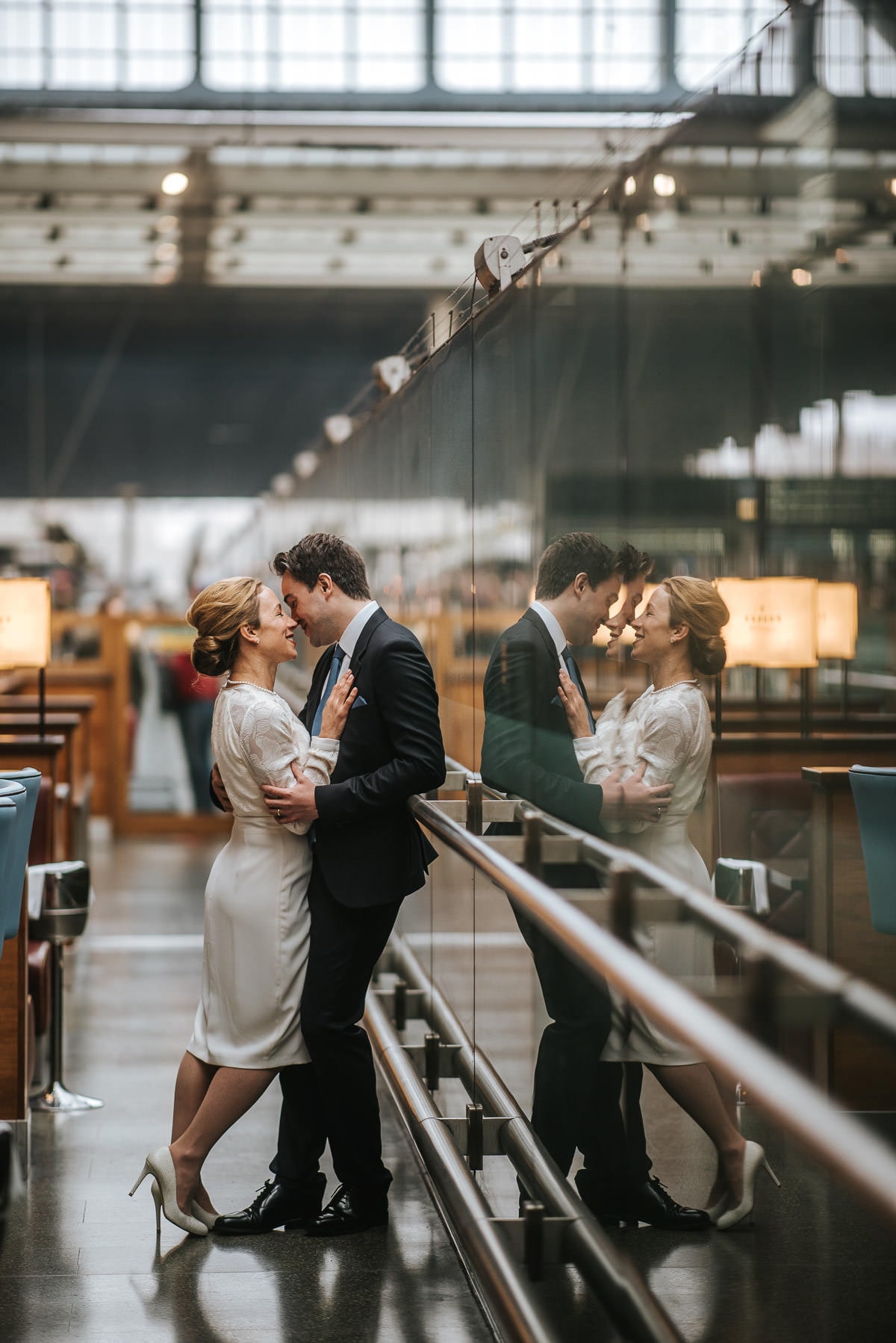 london engagement photography kings cross couple hugging at the train station