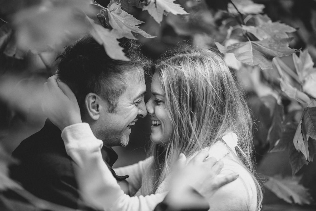 london engagement photography greenwich park smiling around leaves