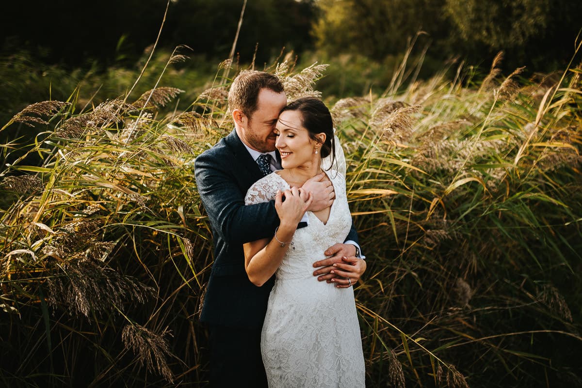 london wetland centre wedding bride and groom embracing