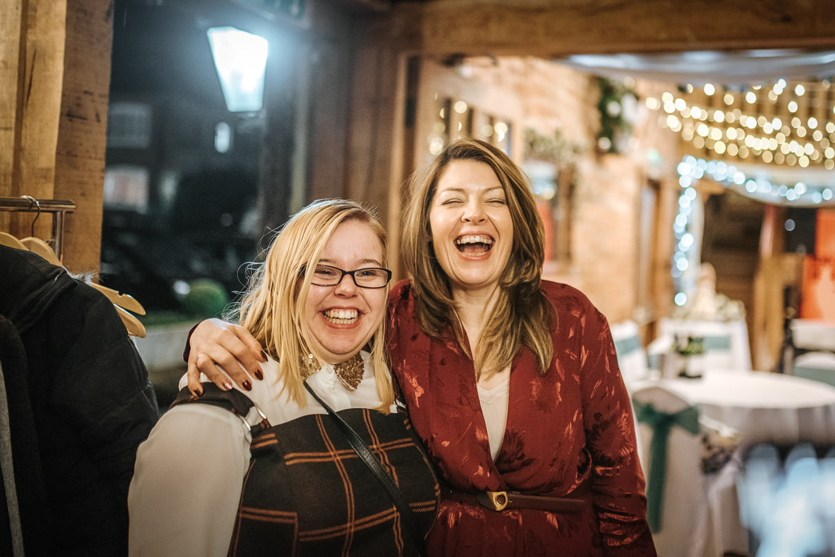tewin bury farm wedding guests laughing