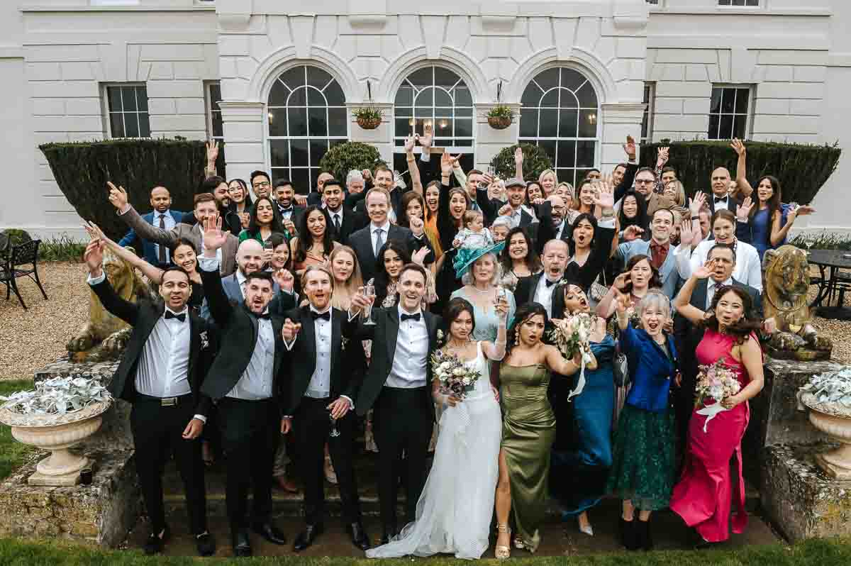 gosfield hall wedding group phot on steps