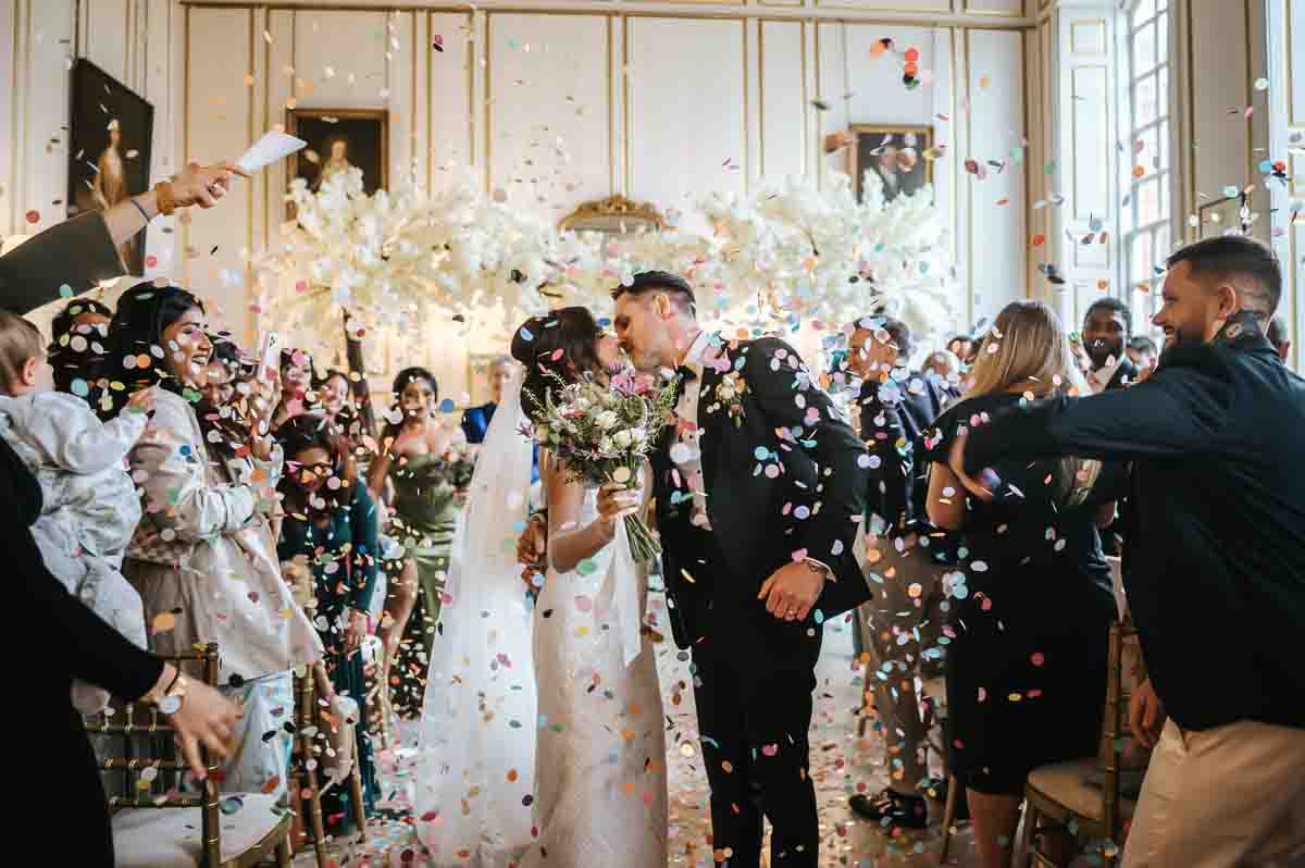 gosfield hall wedding indoor confetti kiss