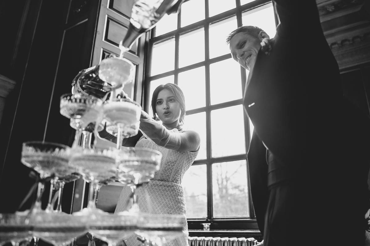 gosfield hall wedding champagne tower pouring