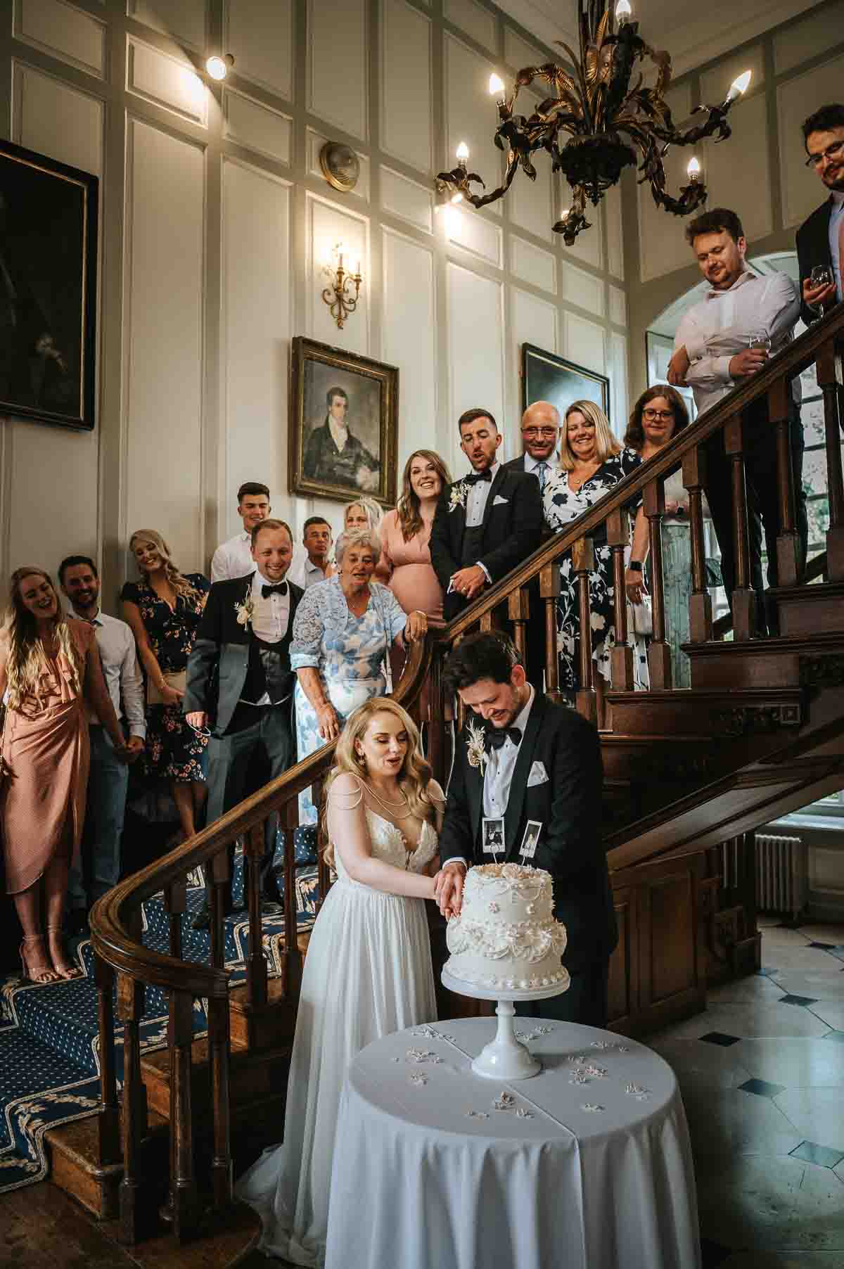 gosfield hall wedding cutting of the cake
