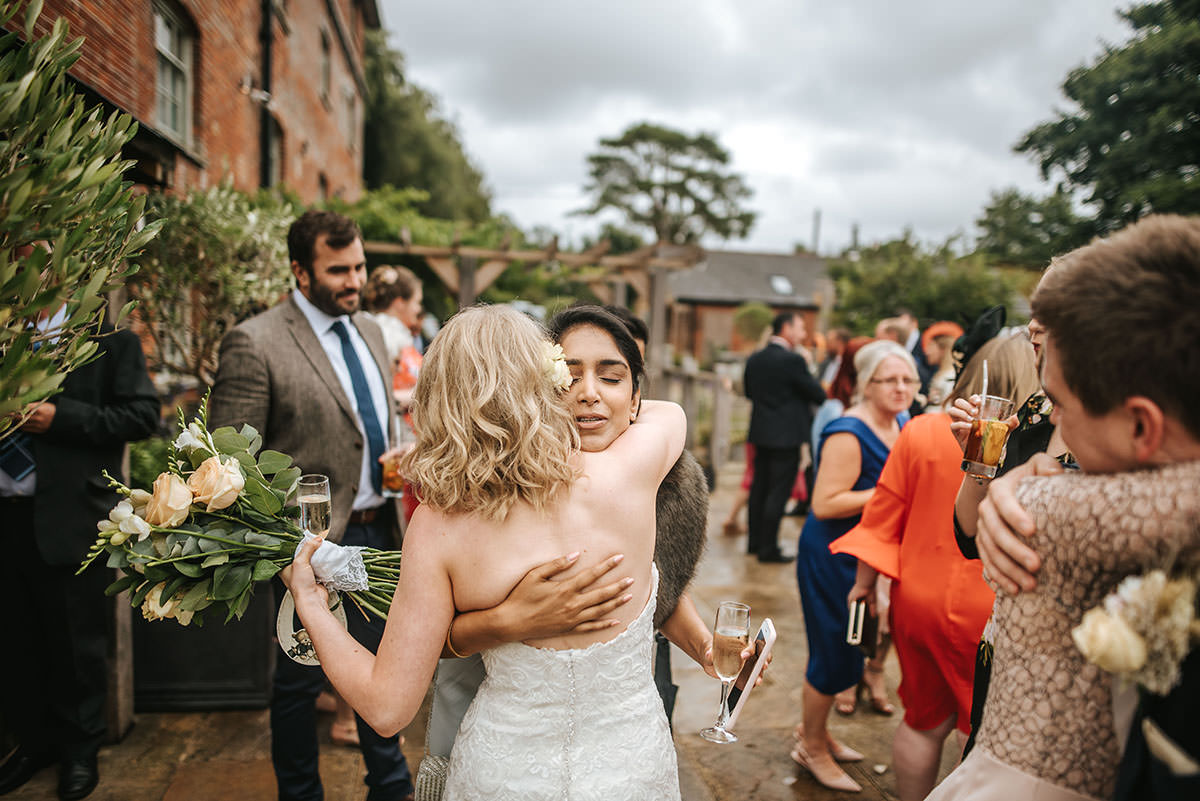 sopley mill wedding drinks reception hugs