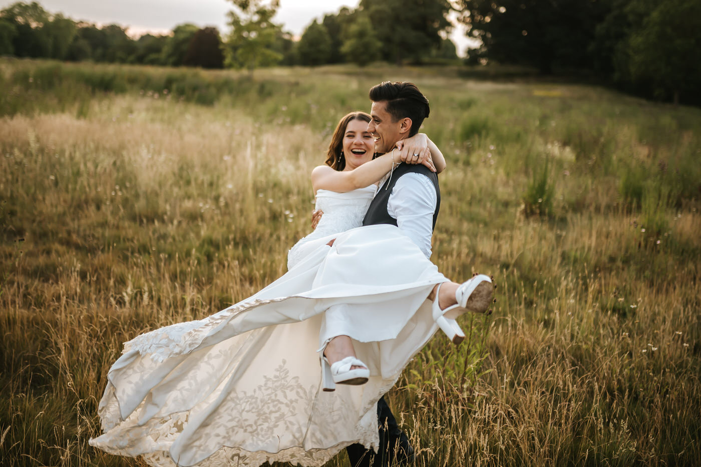 braxted park wedding groom spinning the bride