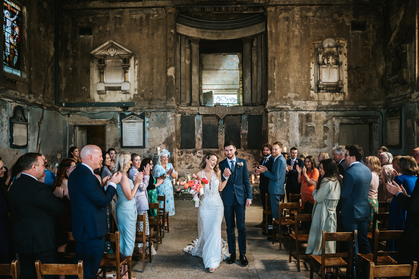 asylum chapel wedding newlyweds walking back down the isle