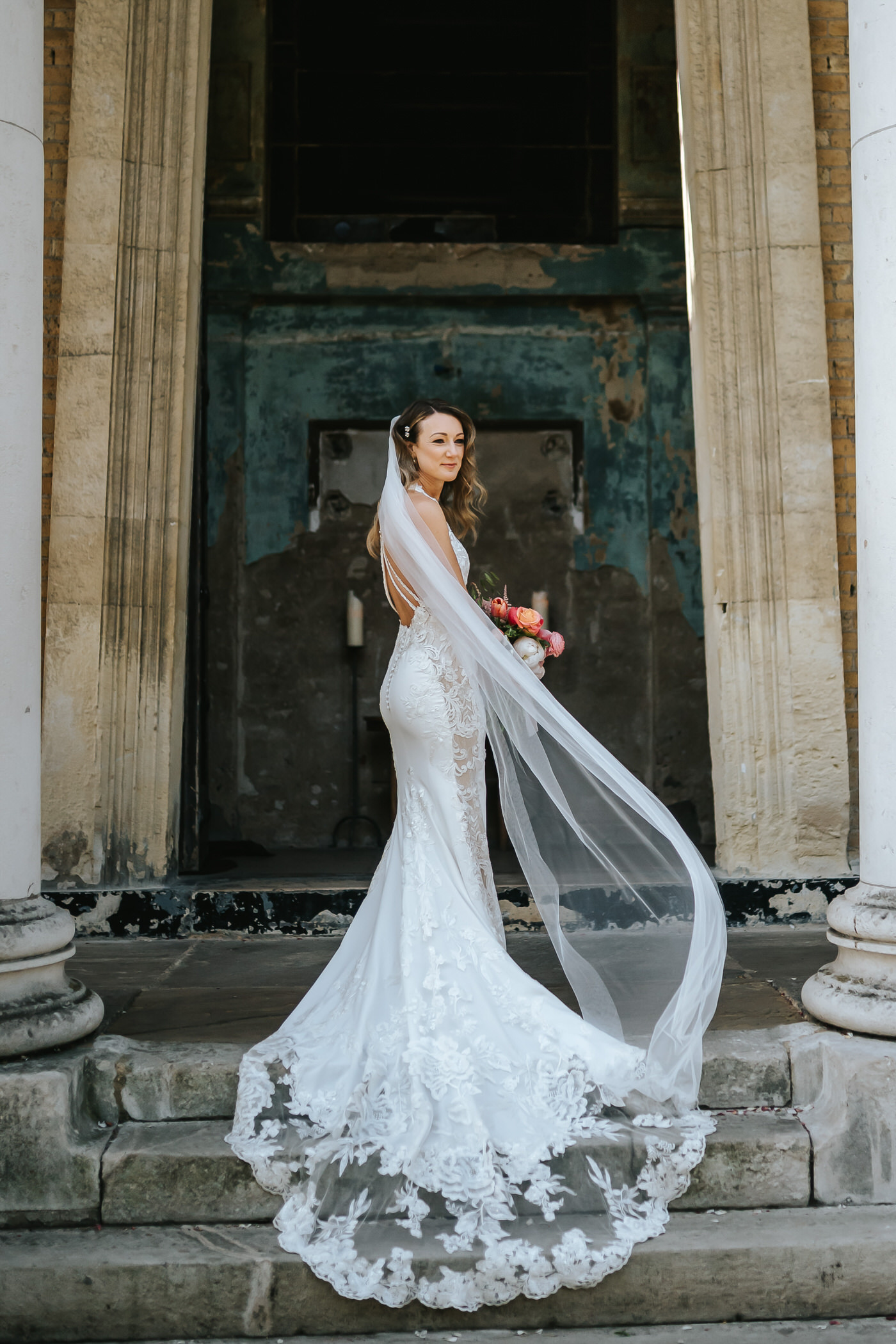 asylum chapel wedding full body shot bride posing in front on the venue
