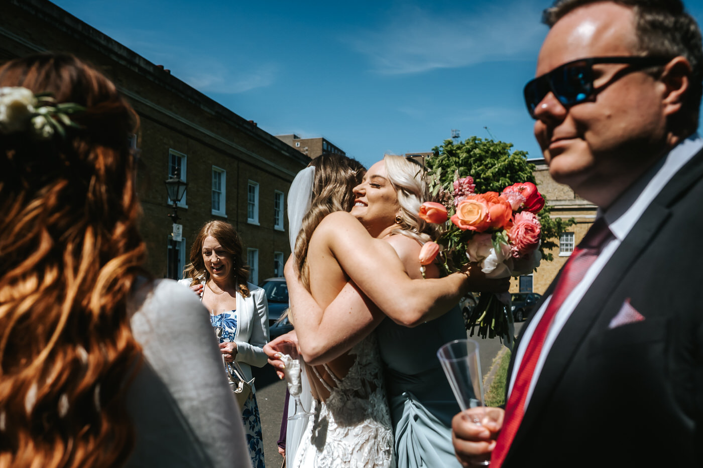 asylum chapel wedding guest hugging the bride