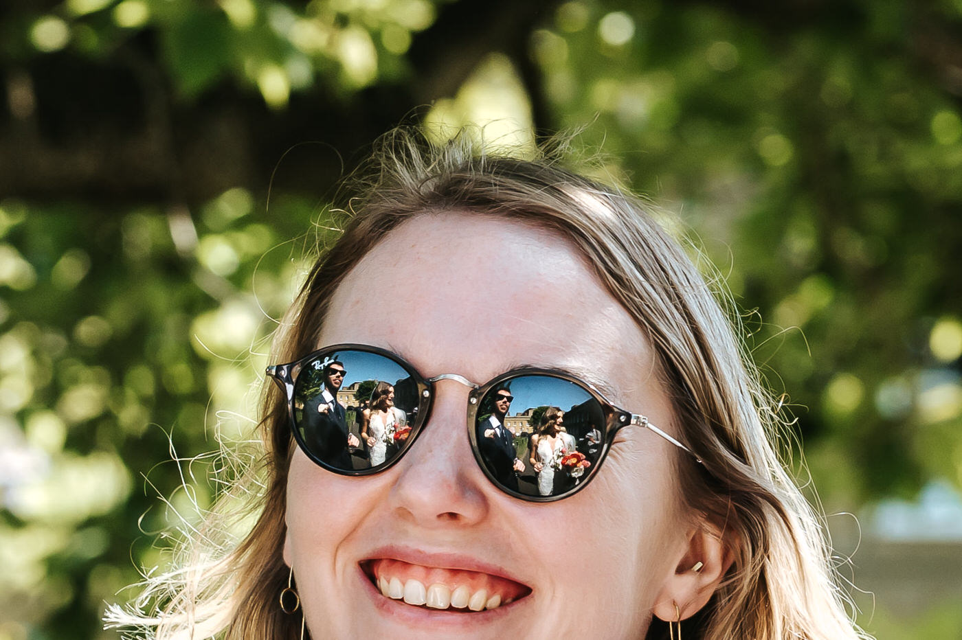asylum chapel wedding newlyweds reflacting in guest's sunglasses