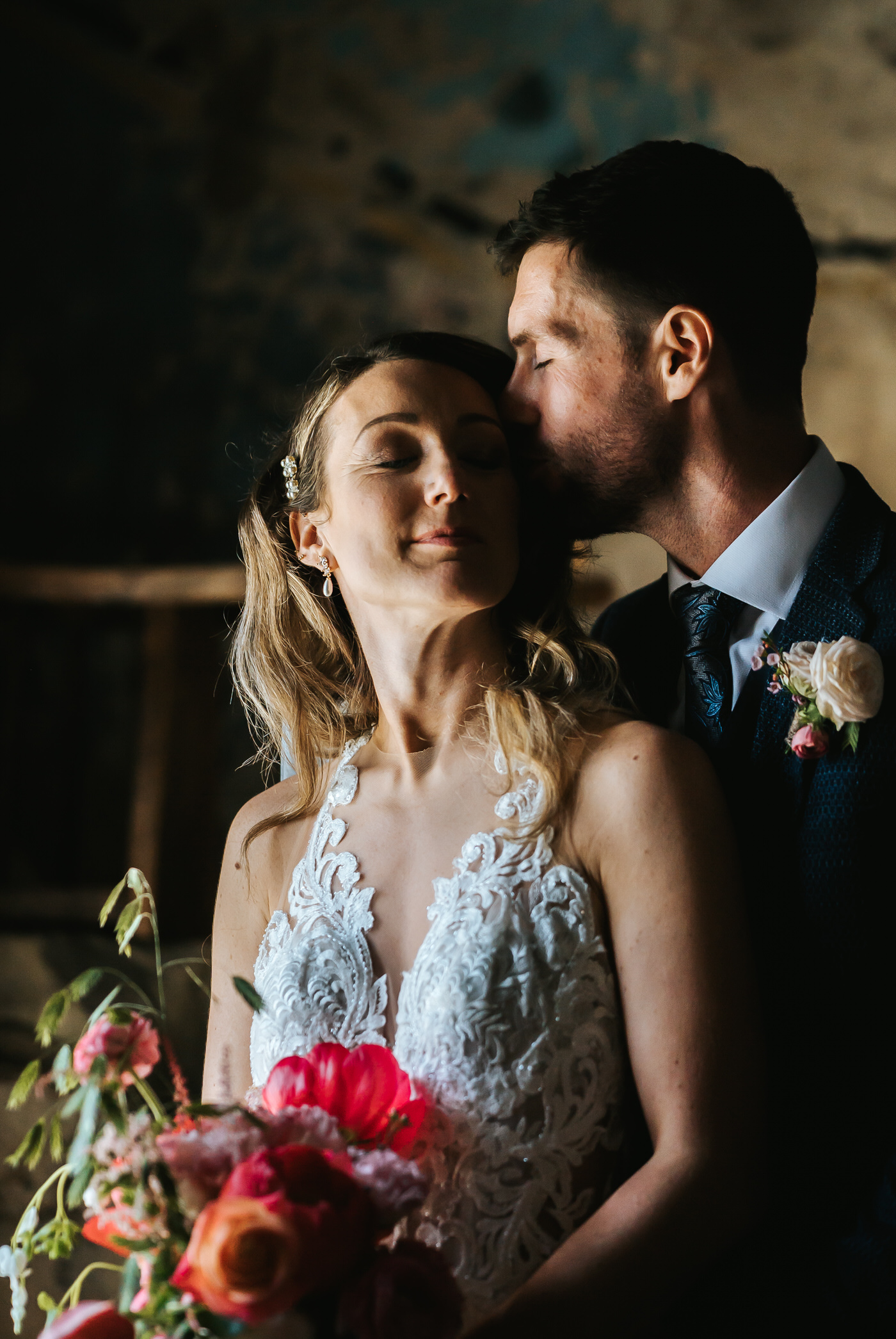 asylum chapel wedding closup of bride and groom standing by a window