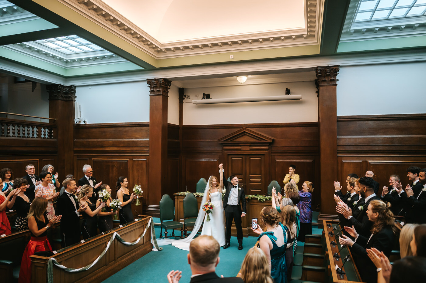Camden Town Hall wedding ceremony people cheering for the newlyweds