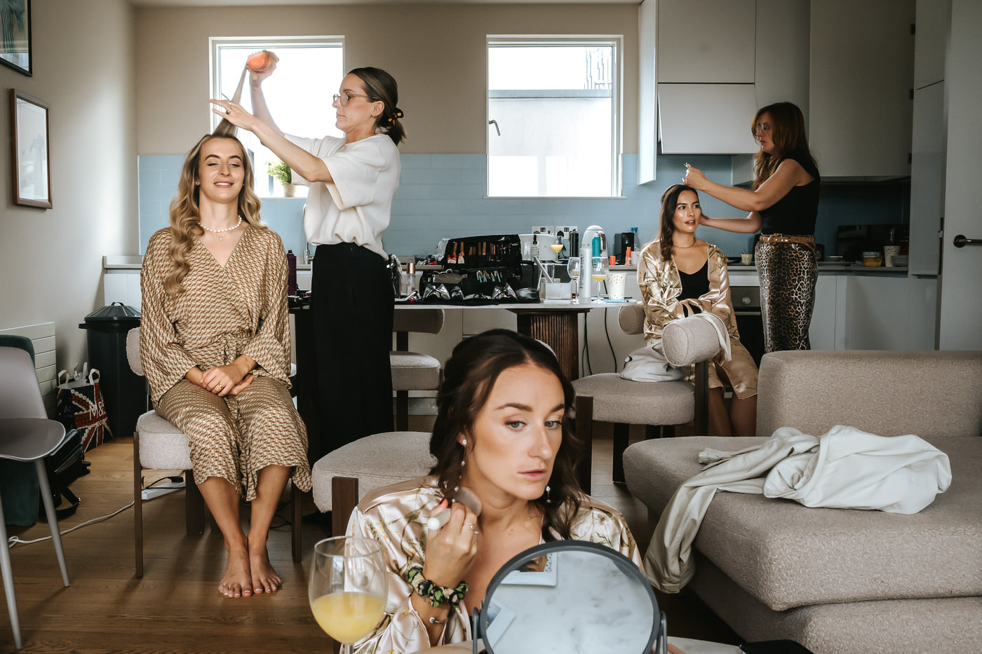 bride and bridesmaids getting ready before the camden town hall wedding