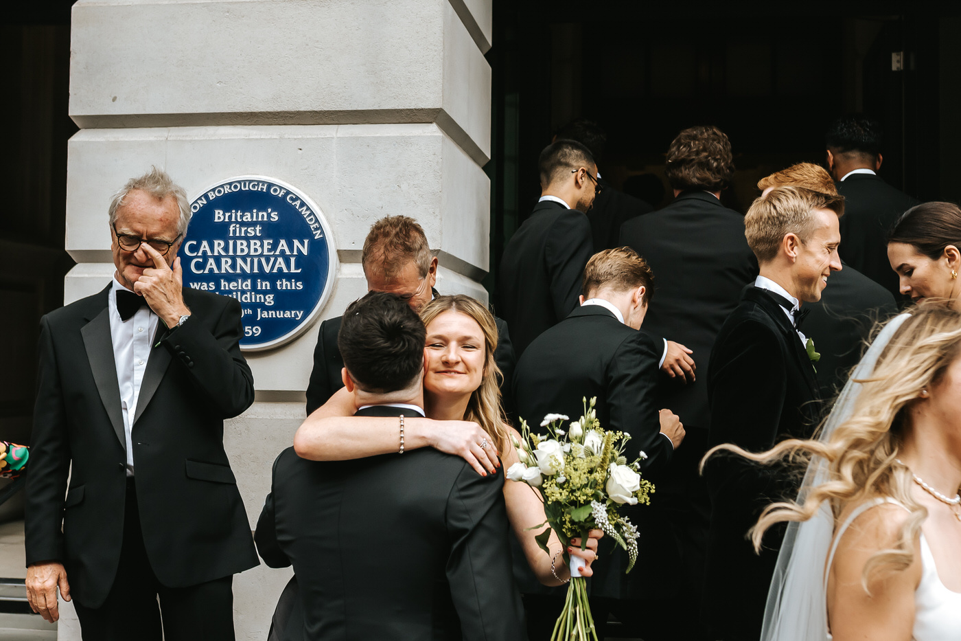 Camden Town Hall wedding guests hugging