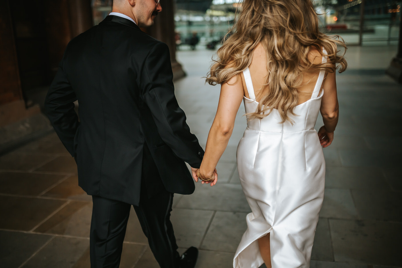 Camden Town Hall wedding couple shoot on nearby London streets couple running holding hands