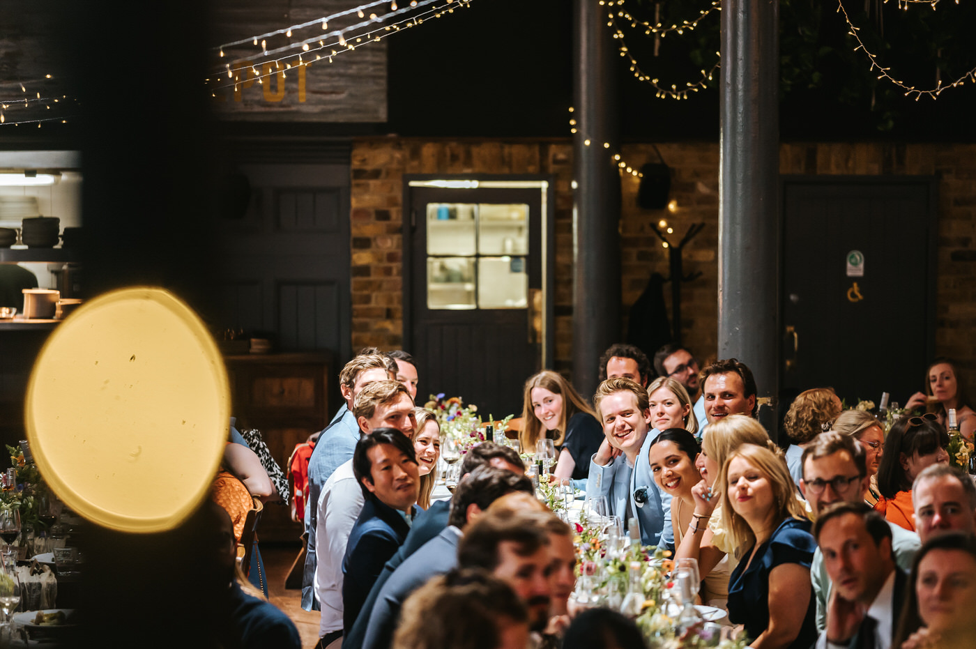 depot wedding guests listening to a speech