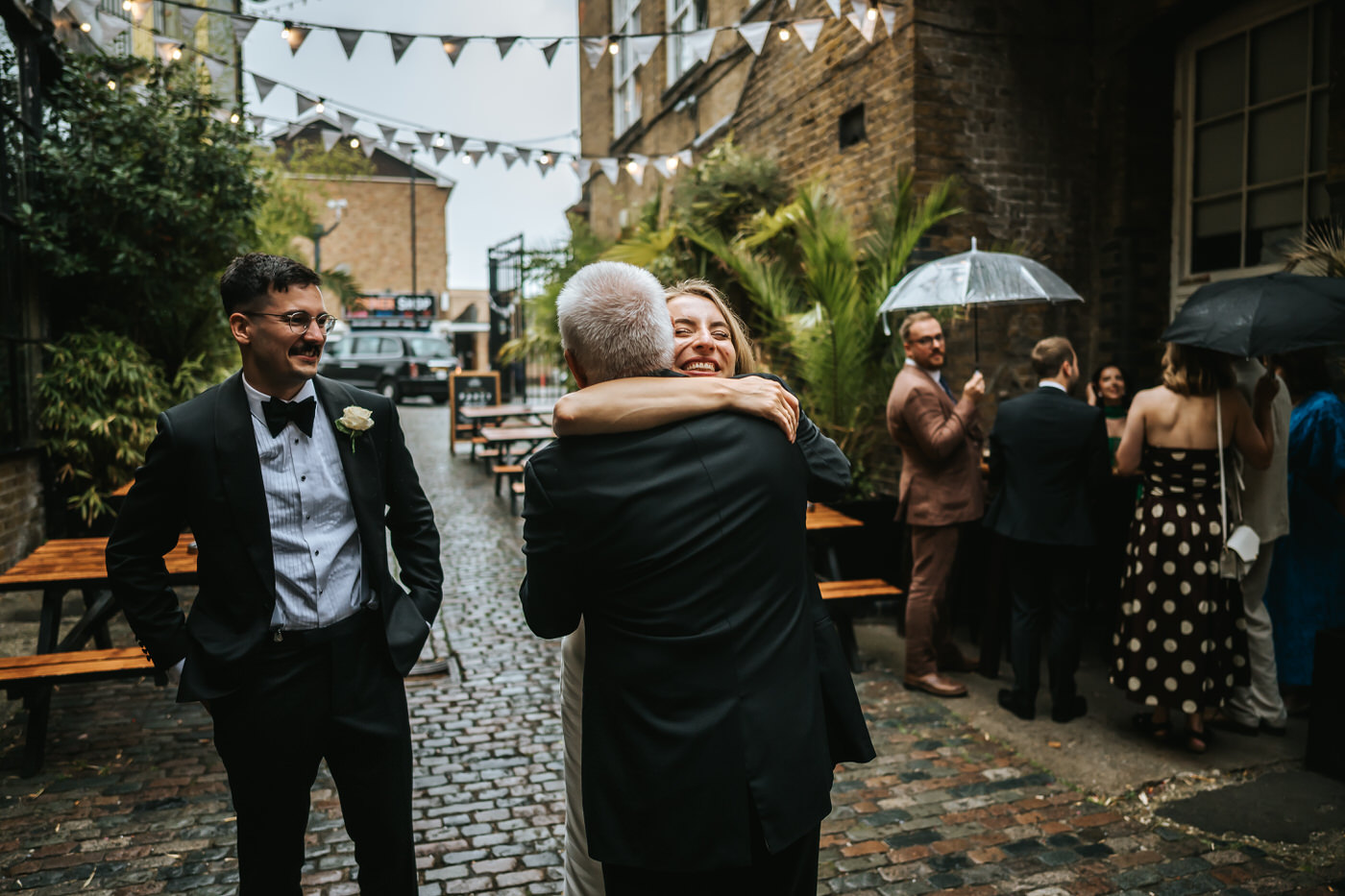 the depot wedding newlyweds hugging ouside the depot n7