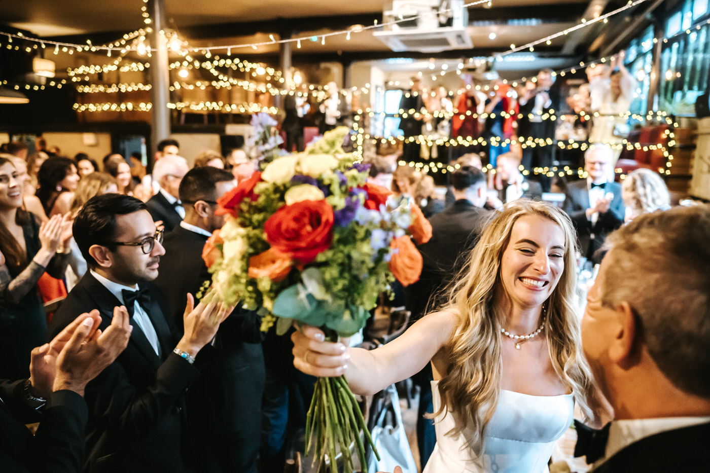 depot wedding bride hugging guests
