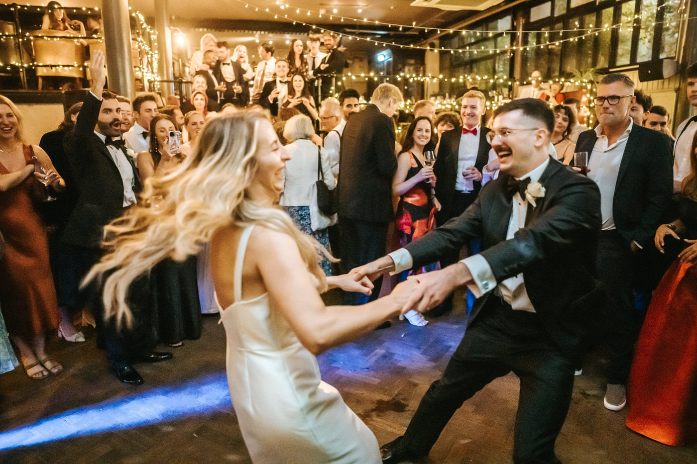 depot wedding party bride and groom dancing and spinning