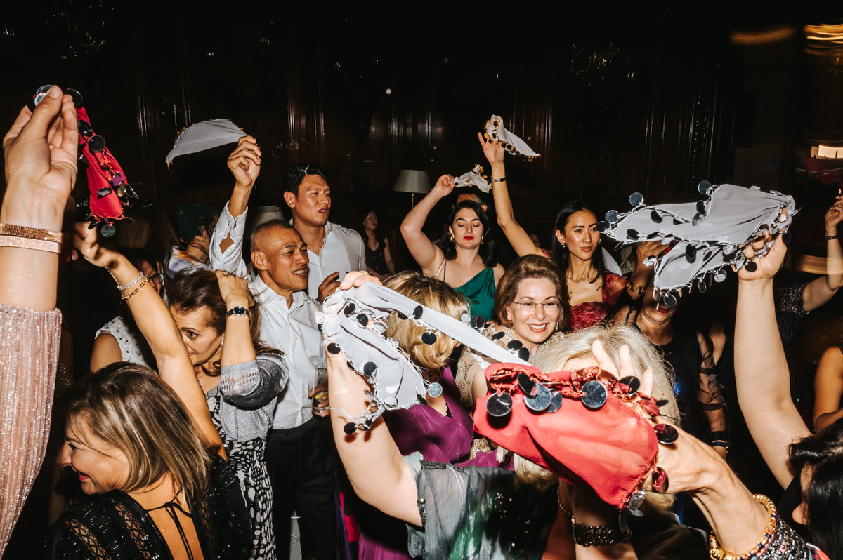 ashridge house wedding guests dancing and spinning their handkerchiefs in the air