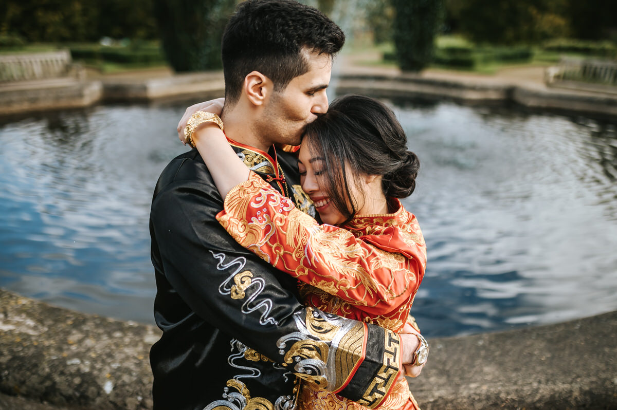 ashridge house wedding groom kissing bride on the forehead