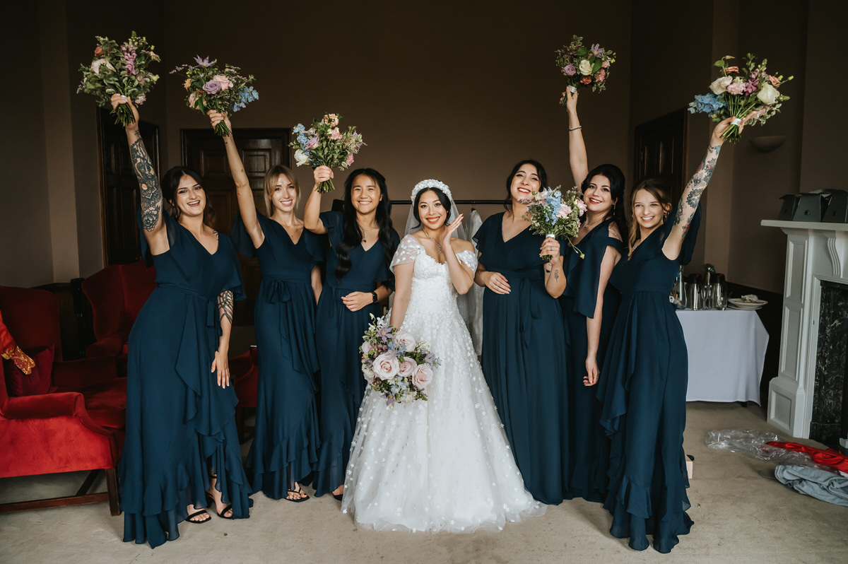 ashridge house wedding bride and bridesmaids posing for a shot