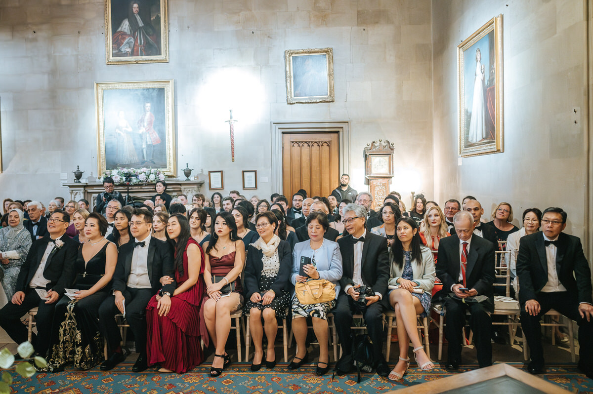 ashridge house wedding ceremony wide shot of the guests sitting