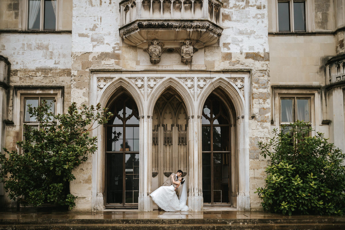 ashridge house wedding bride and groom going for a dip outside with ashridge house in the background