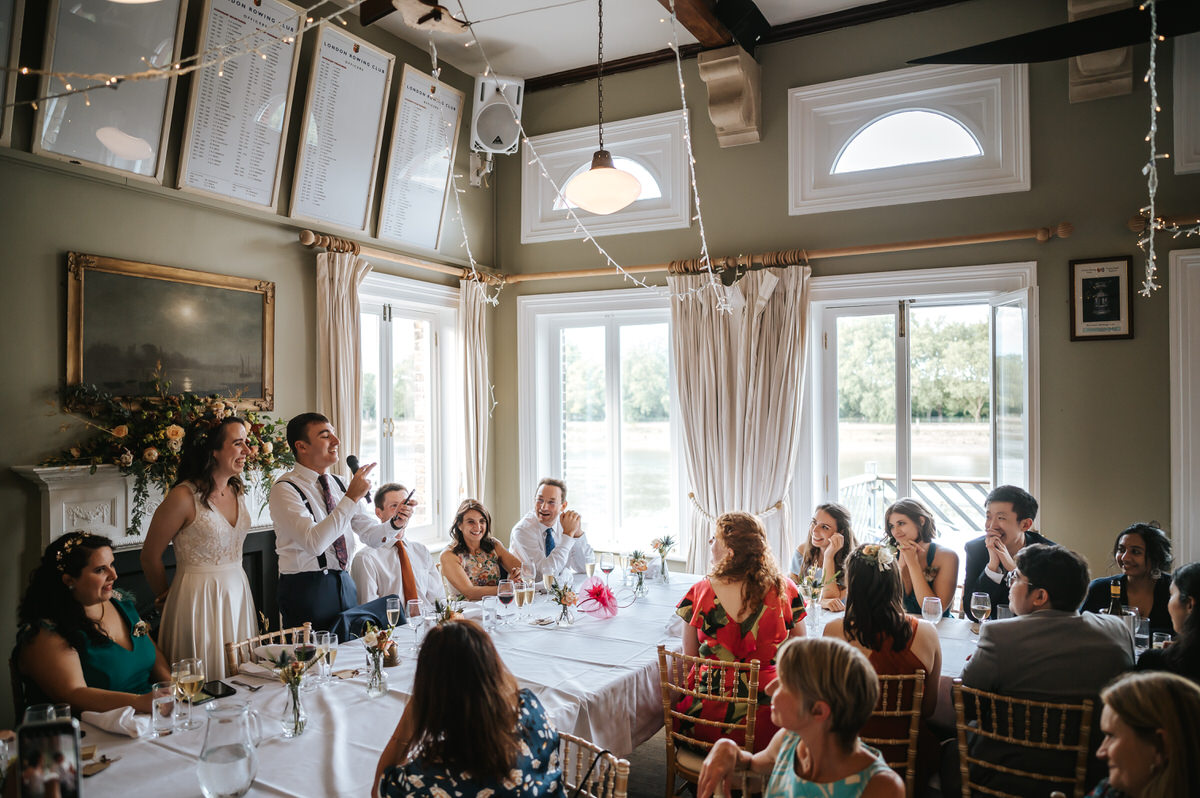 london rowing club wide shot of wedding speech of the groom
