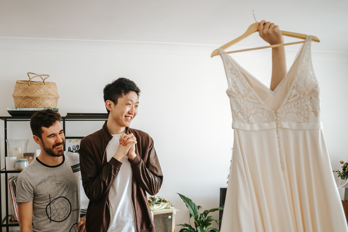 london rowing club wedding guestd admiring the wedding dress
