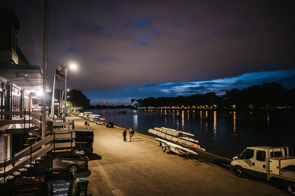 london rowing club wedding wide shot of the venue and river thames at dusk